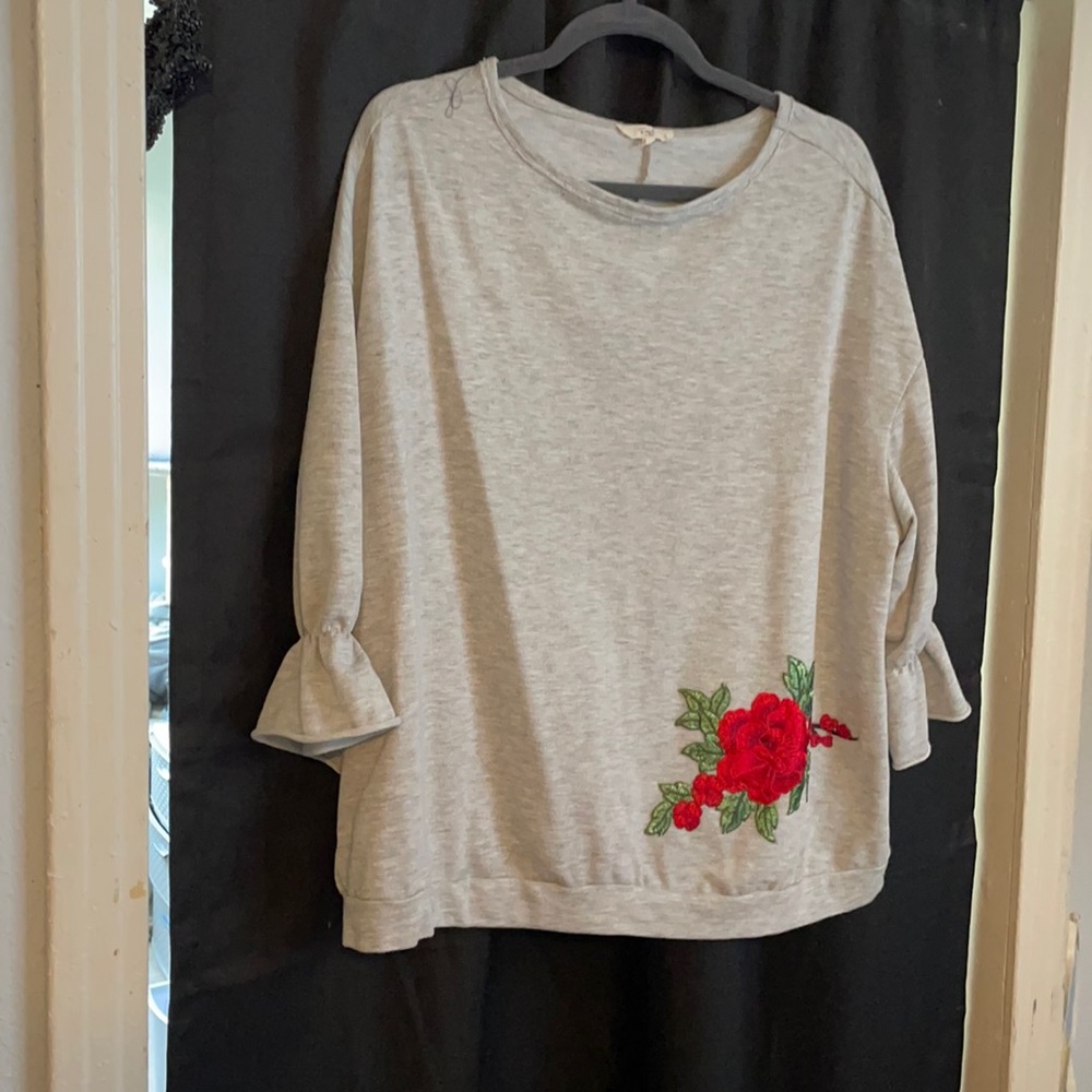 Easel grey sweater. Size large. Rose appliqué